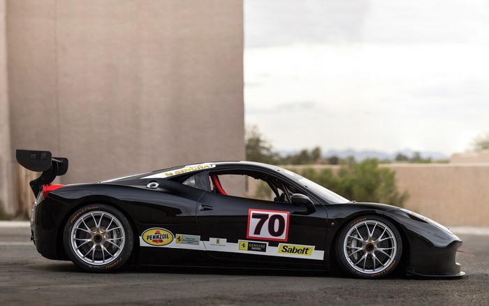 Black Ferrari 458 Challenge Evoluzione race car with number 70