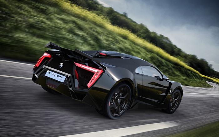 Black Lykan Hypersport driving on a road