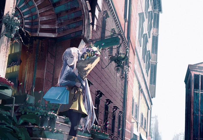 Girl with flowers and shopping bags on a street