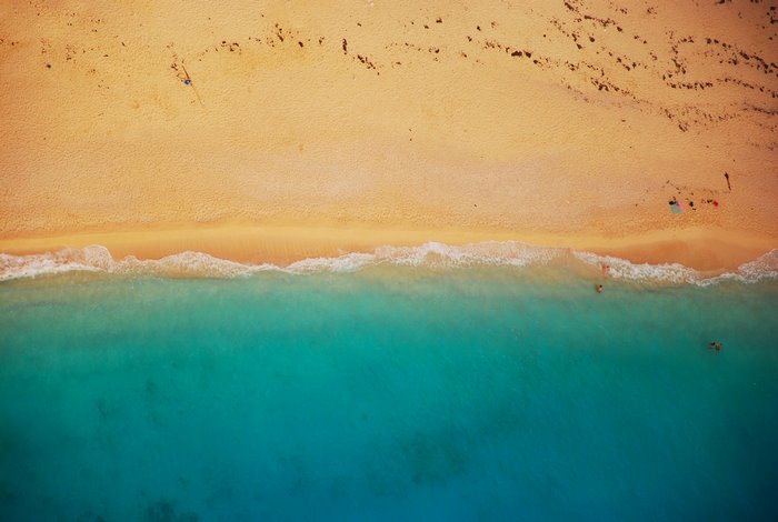 Aerial view of a sandy beach and turquoise ocean