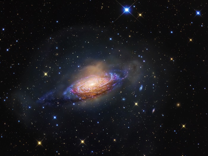 Galaxy NGC 3521 and stars in space