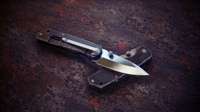 Folding knife on a textured surface