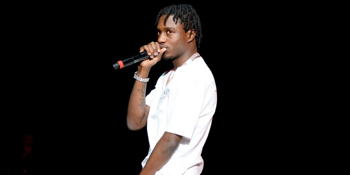 Lil Tjay performing on stage