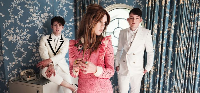 Echosmith band members Sydney Sierota and two men