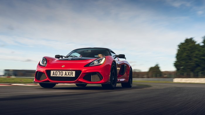 Red Lotus Exige Sport 420 driving on a track