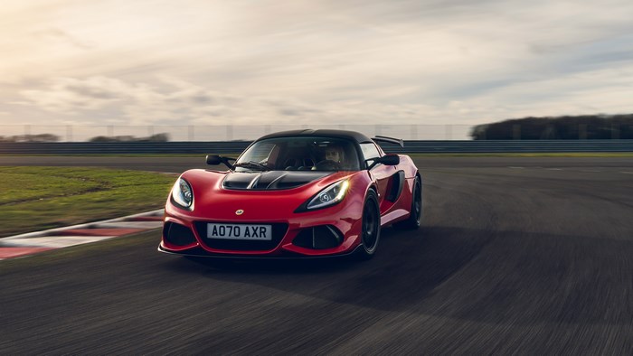 Red Lotus Exige Sport 420 driving on a race track