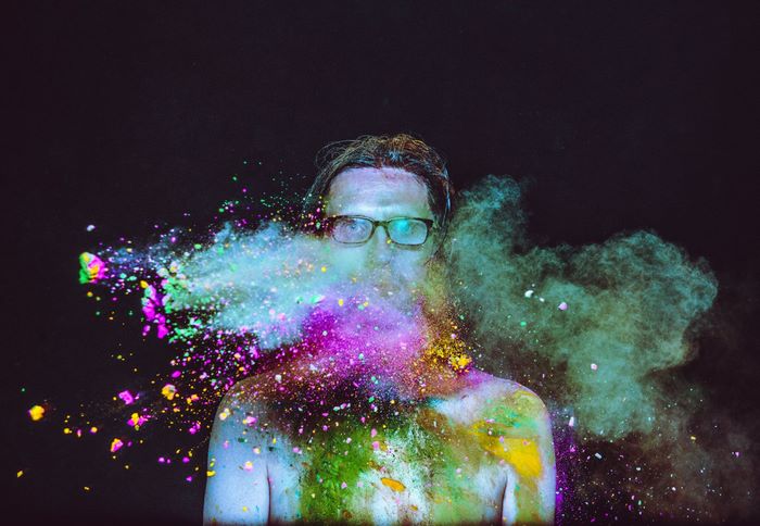 Steven Wilson covered in colorful powder