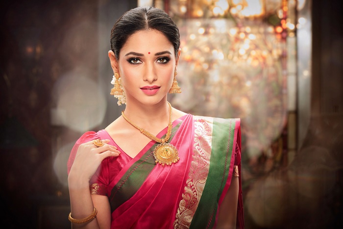 Tamannaah Bhatia wearing traditional Indian jewelry and saree