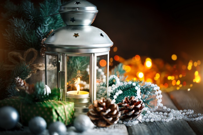 Christmas lantern with candle and pine cones
