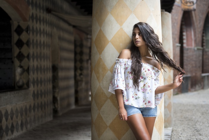 Brunette Woman with Long Hair and Shorts
