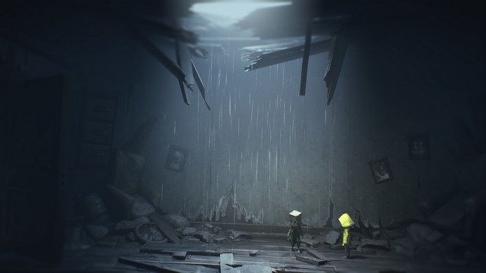 Mono and Six from Little Nightmares II in a ruined room