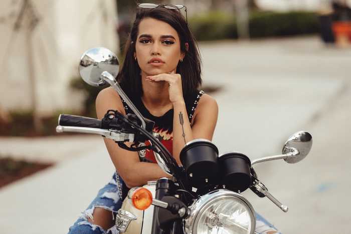 Woman posing on a motorcycle
