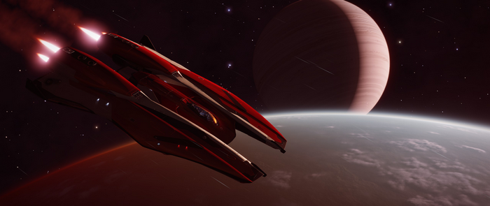 Red spaceship flying near planets in Elite: Dangerous