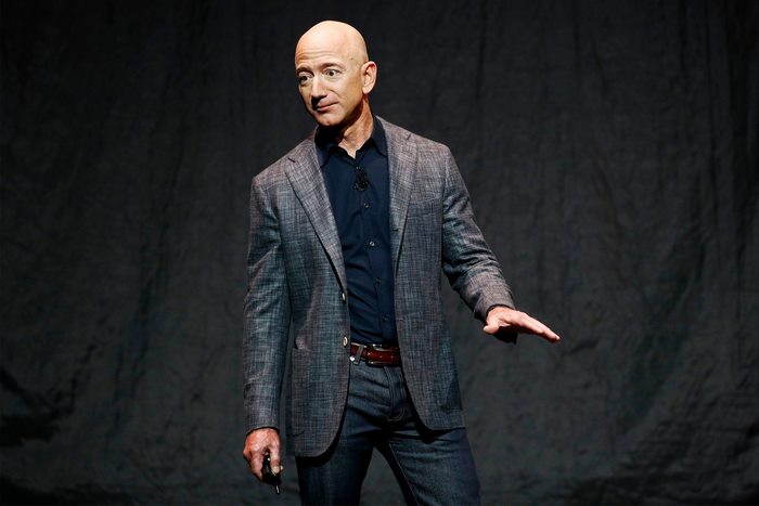 Jeff Bezos wearing a suit and jeans