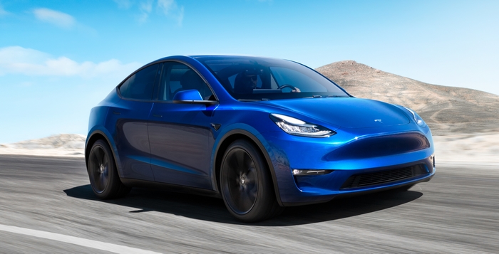 Blue Tesla Model Y Electric Car Driving