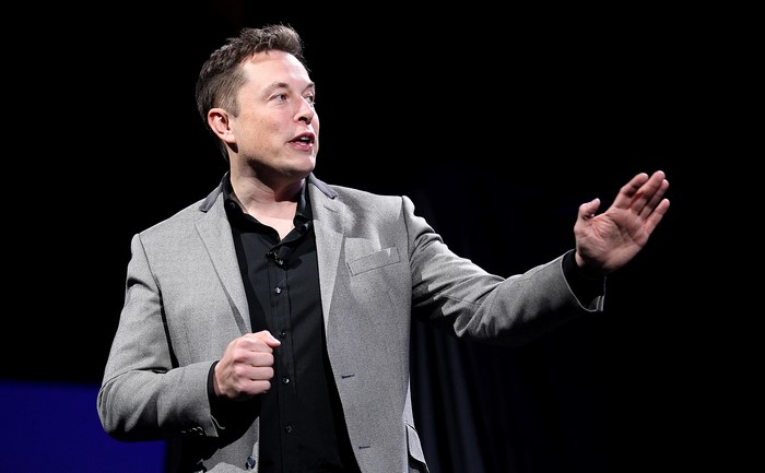 Elon Musk speaking on stage