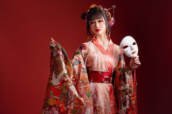 Woman in Kimono Holding a Mask