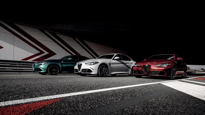 Three Alfa Romeo Giulia Quadrifoglio cars on a track