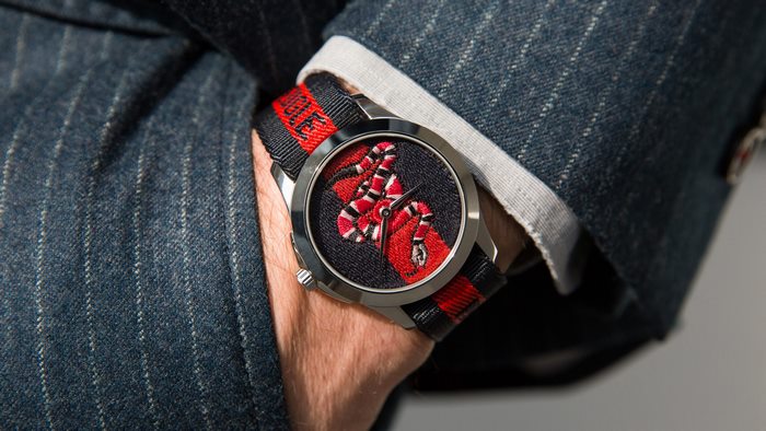 Gucci snake watch on a man's wrist
