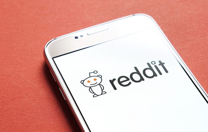 Reddit logo on a smartphone screen