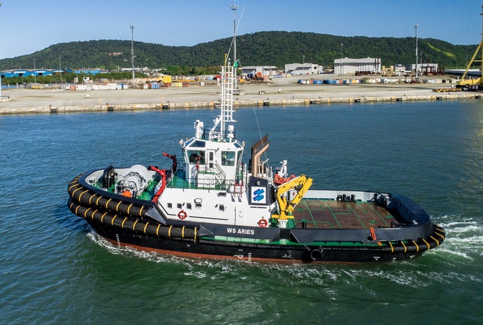 Tugboat WS Aries sailing in a harbor