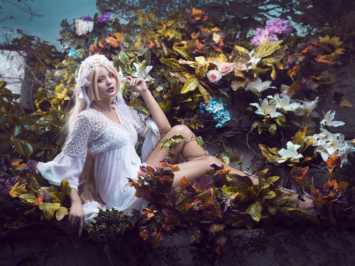 Woman in White Dress with Blonde Hair and Flowers