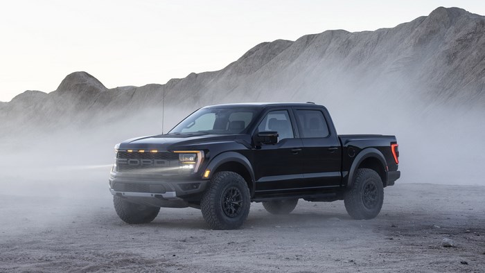 Black Ford F-150 Raptor Pickup Truck in Foggy Mountains