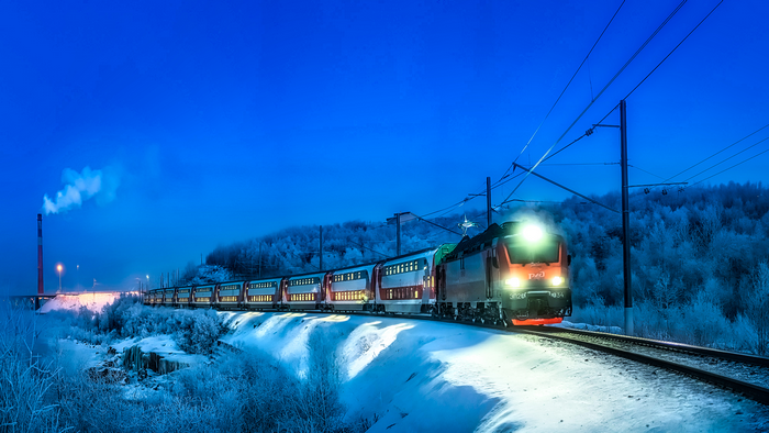 Passenger train in snow at night
