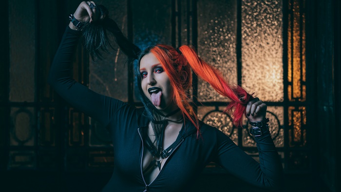 Woman with twintails and Harley Quinn makeup