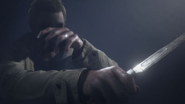 Ethan Winters holding a knife