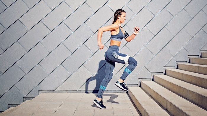 Woman running up stairs