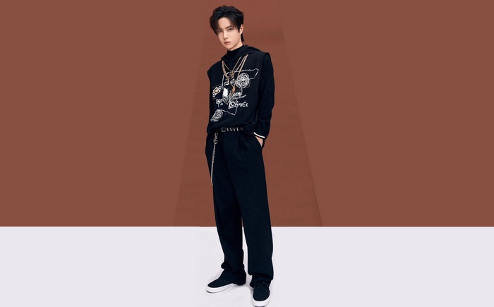 Wang Yibo in black outfit with Chanel print