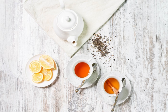 Tea set with lemon slices and cinnamon stick