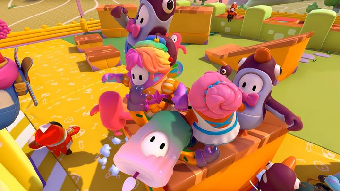 Fall Guys characters on a colorful obstacle course