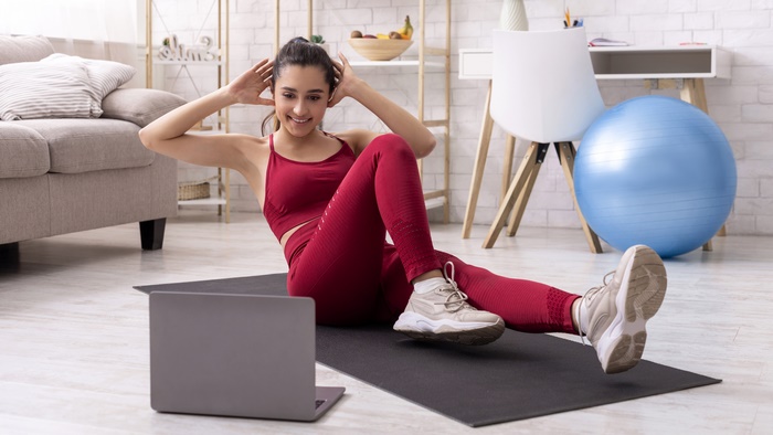 Woman doing crunches at home