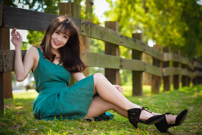 Smiling Asian Woman in Green Dress
