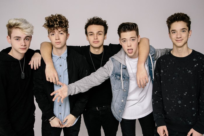 Why Don't We band members posing
