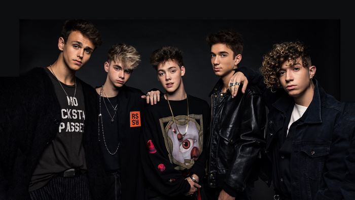 Why Don't We band members posing