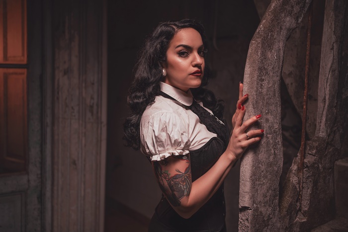 Woman with black hair and tattoo