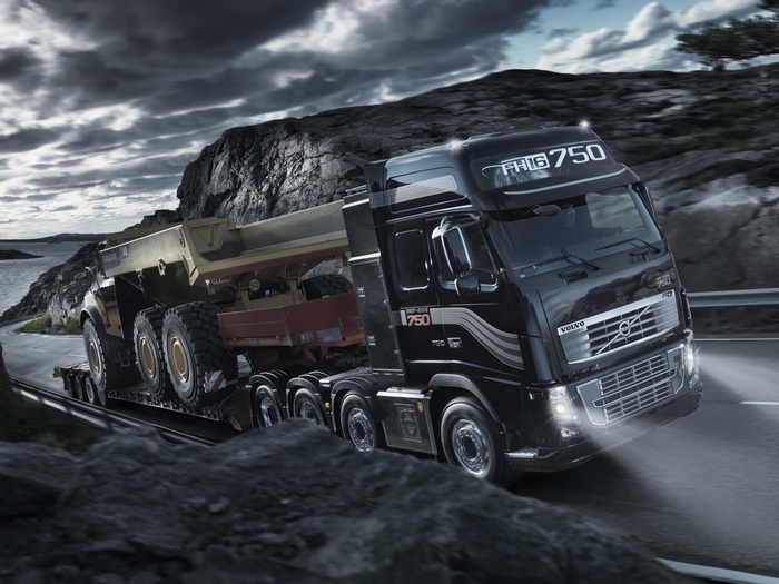 Volvo FH16 750 truck transporting a mining vehicle