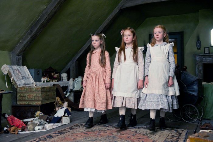 Three young girls in an attic