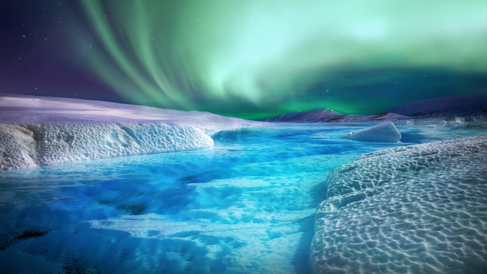 Aurora Borealis over icy river