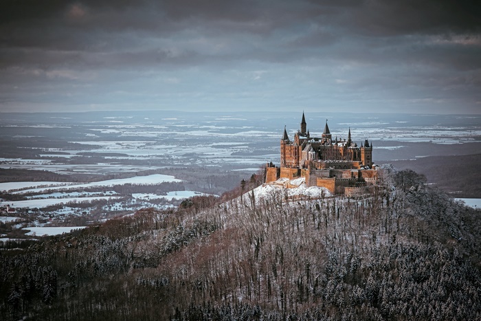 Hohenzollern Castle on a snowy mountain landscape