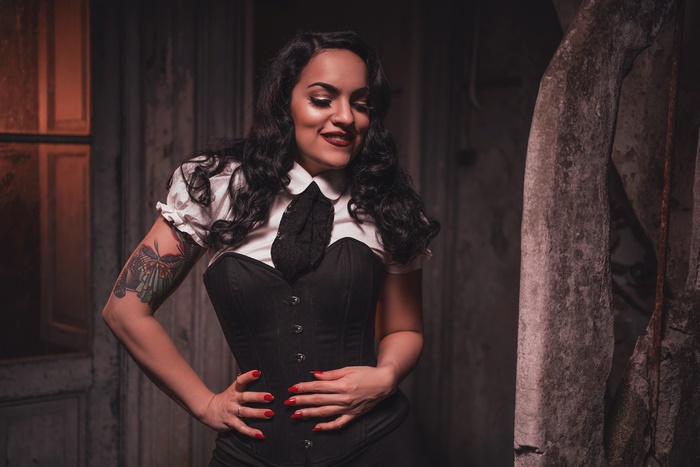 Woman with black hair and butterfly tattoo