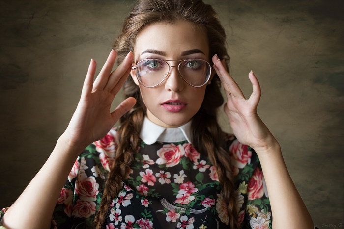 Young Woman with Braided Hair and Glasses