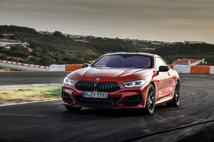 Red BMW 8 Series Coupe on a Race Track