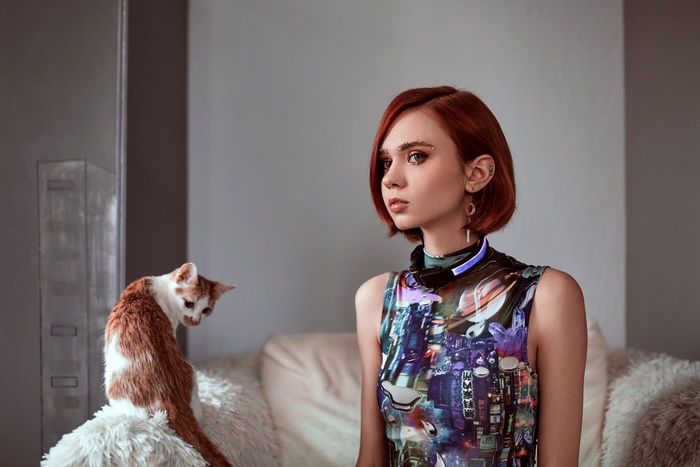 Woman with red hair and cat
