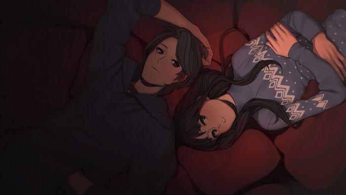 Couple lying down on red cushions
