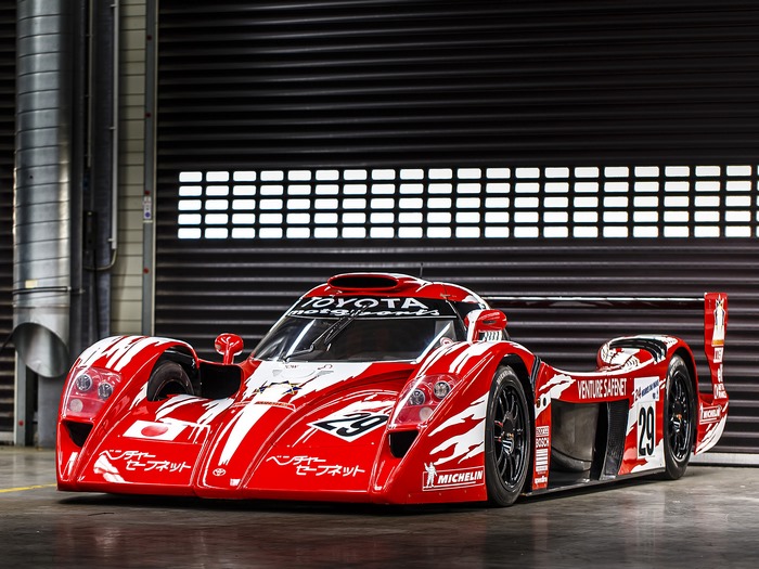 Red Toyota GT One race car with Japanese flag