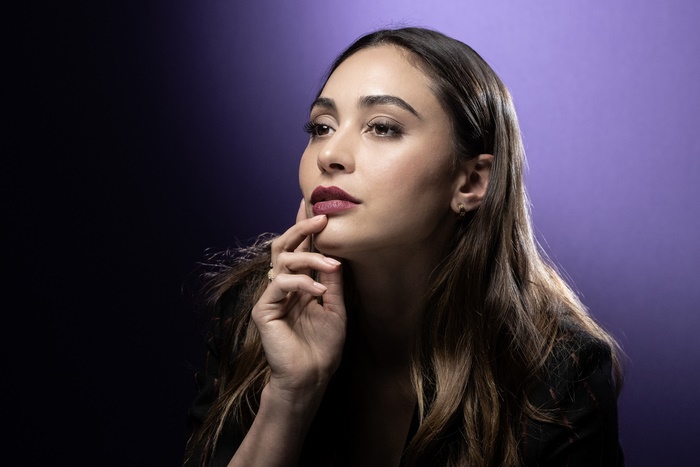 Lindsey Morgan with dark hair and lipstick